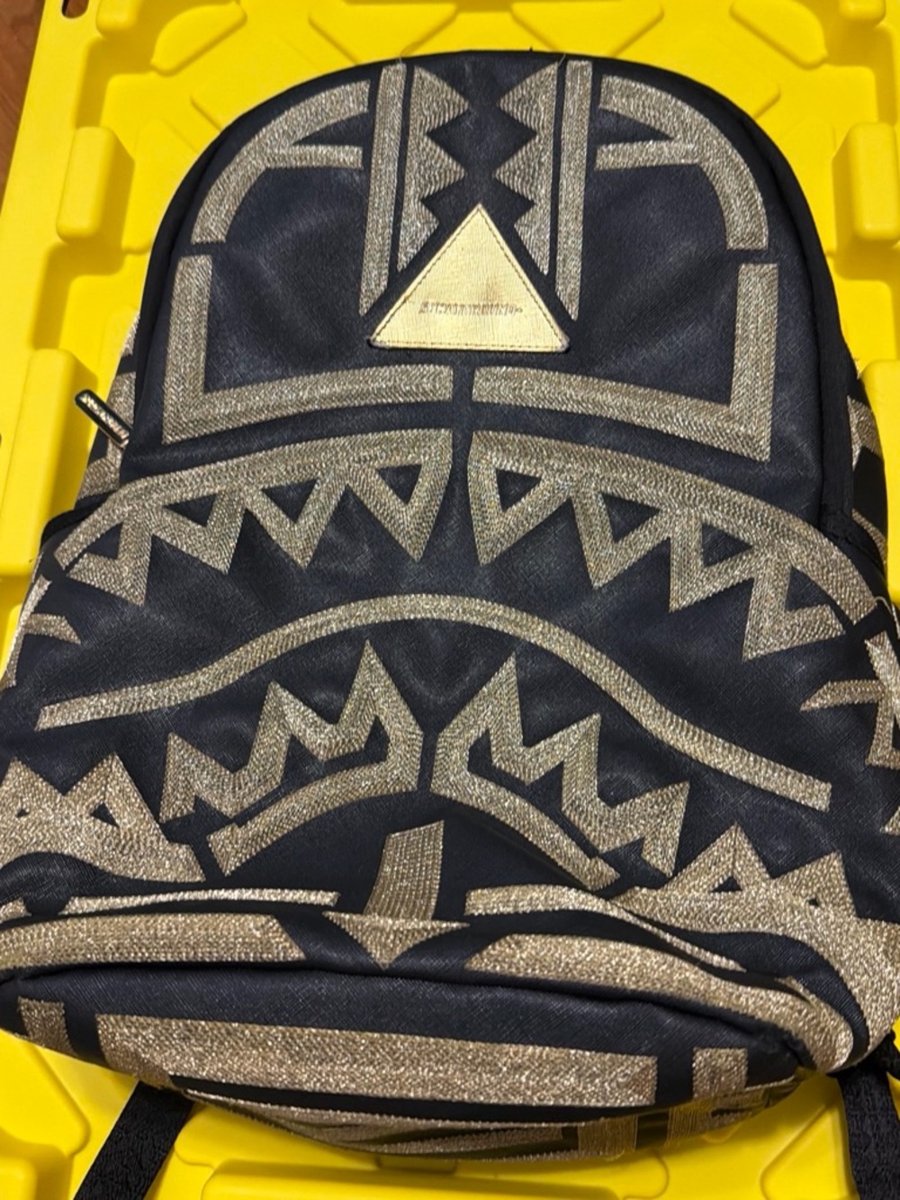 Sprayground Black Backpack with Metallic Gold Tribal Pattern